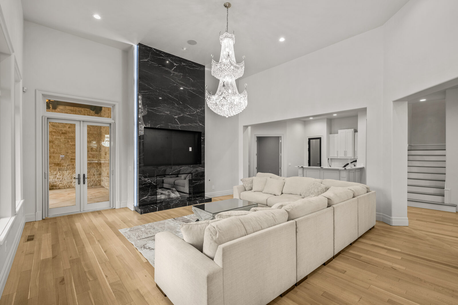 European estate in Oklahoma City — family room with black marble fireplace